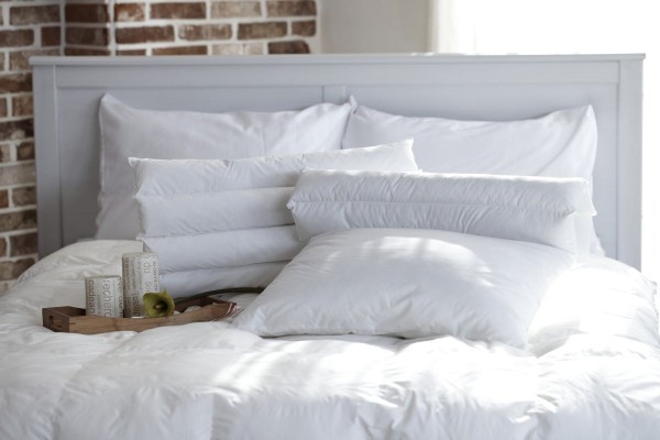 white color quilts at bed with two pillows