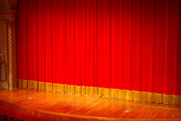 red stage curtain with bullion fringe